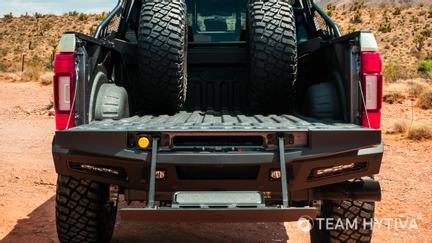 Rear View of the Tailgate Step Bed and Spare Wheels and Tires