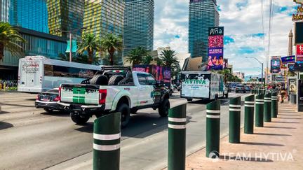 Team Hytiva Super Baja and F-250 and Trailer Driving down The Strip