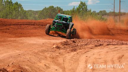 Team Hytiva Polaris RZR Driving Around Turn